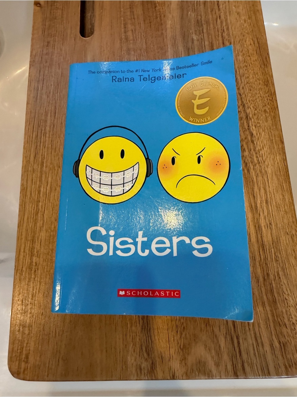 Sisters by Raina Telgemeier
Soft cover - graphic novel